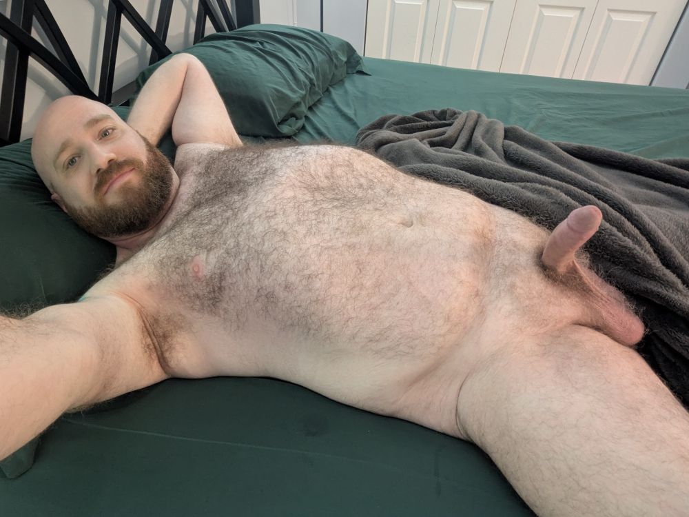 Bear in bed. Hard cock and side ball showing 