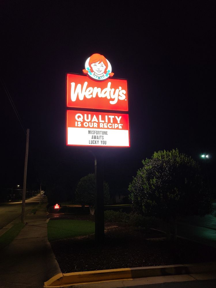 Wendy's sign that says, "Misfortune awaits lucky you"