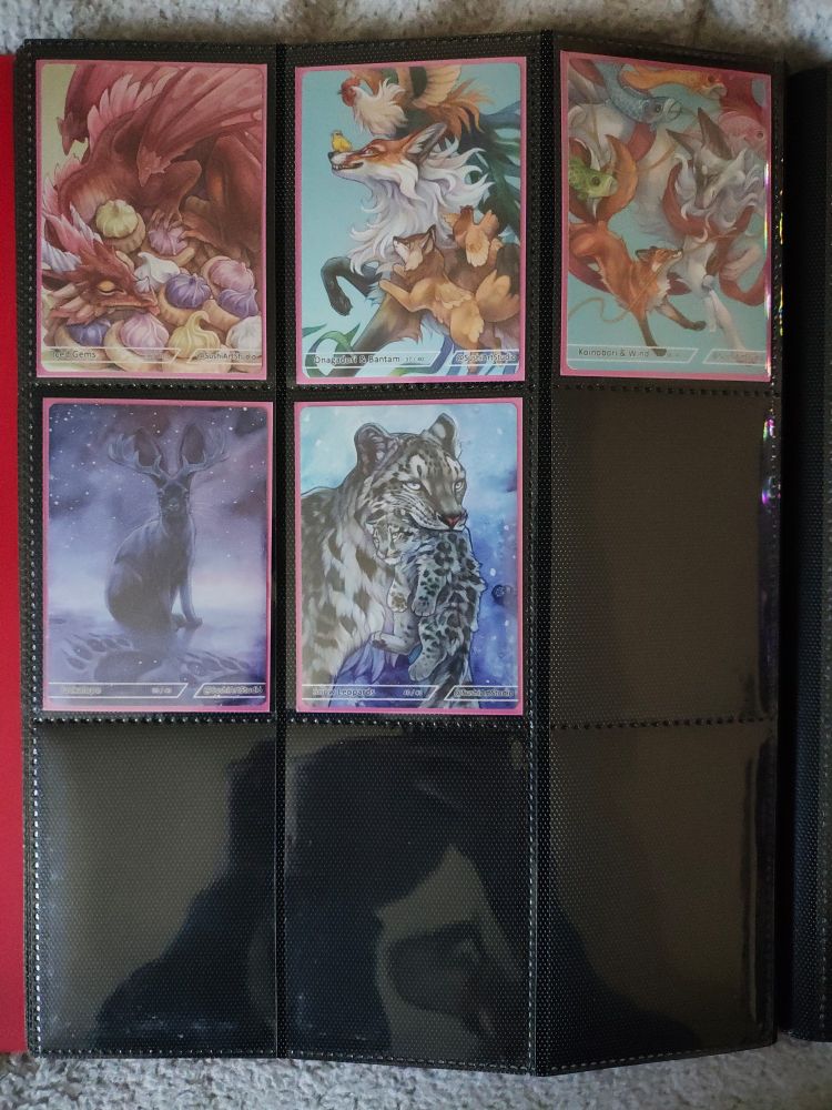 Artwork cards sleeved and stored in a card binder.
