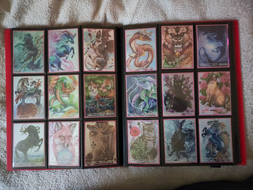 Artwork cards sleeved and stored in a card binder.
