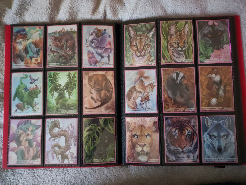 Artwork cards sleeved and stored in a card binder.