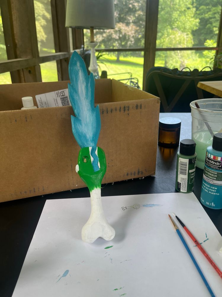 The sword being painted 