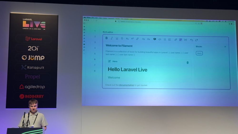 Photo of Dan introducing filament v4 at Laravel live uk. Show casing blocks