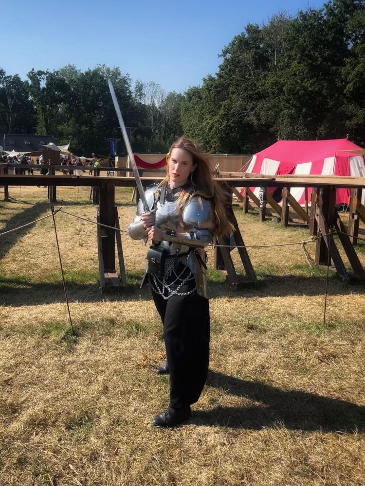 I’m physically incapable of not posting pictures of myself in armour. I’m stood in front of a fighting pen in armour holding a sword and the wind is blowing through my hair. Life is good.
