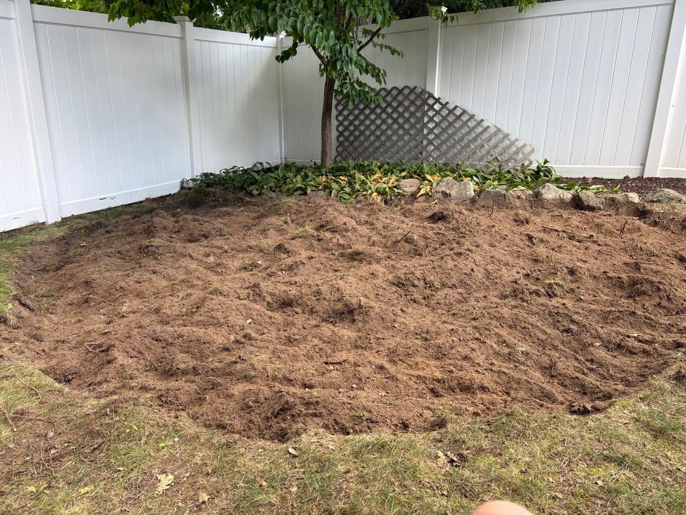 Large circle cut into a yard filled with dirt