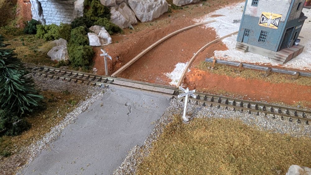 Simple wooden rail way crossing posts.