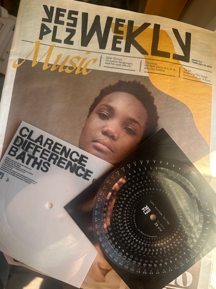 a copy of the Yes Plz Weekly print zine and two flexidisc records. 