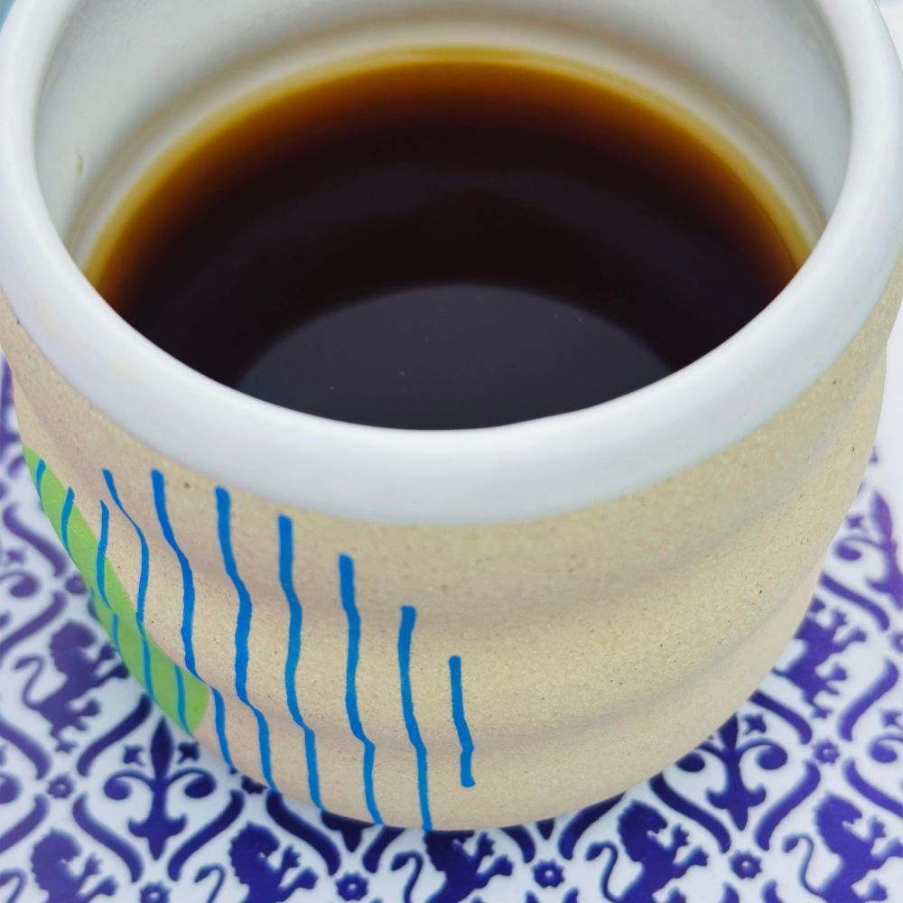 I made a sample of this coffee at 5pm and, even though that’s way too late in the day for me to have coffee, I chugged it mercilessly. This is a photo of it in a mug handmade by Neenineen. 