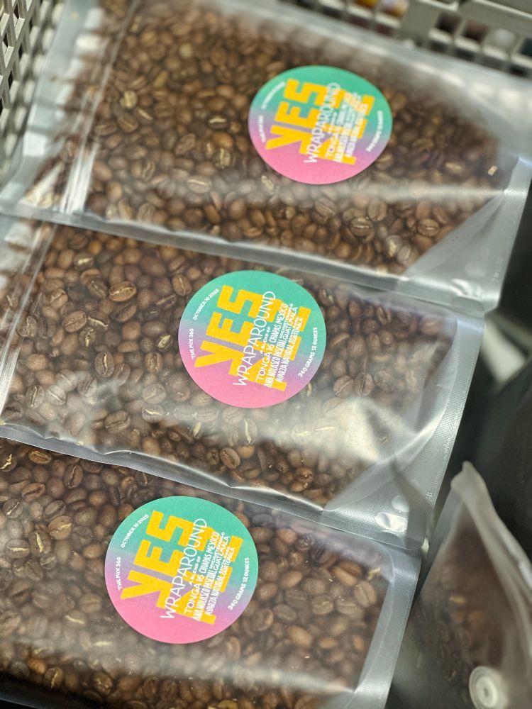 Translucent bags of fresh roasted coffee from YES PLZ with the labels for the 360th interaction of The Mix, our flagship blend with three coffees from Guatemala and Mexico featured. 