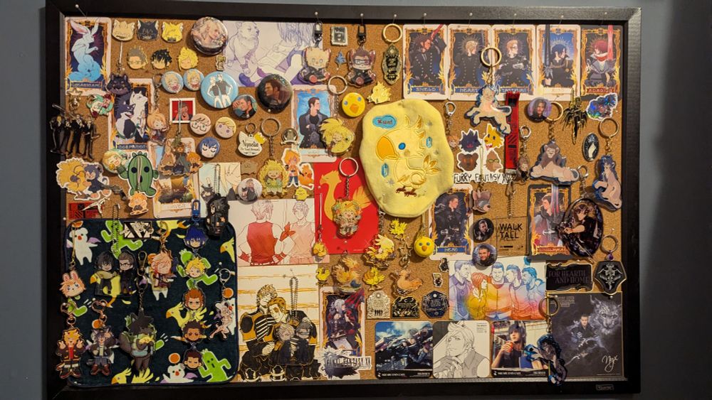 a cork board filled to the brim with final fantasy xv merch