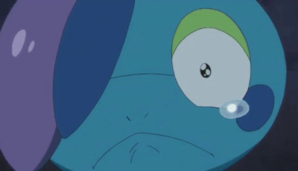 a close up of a cartoon character with a tear coming out of its eye