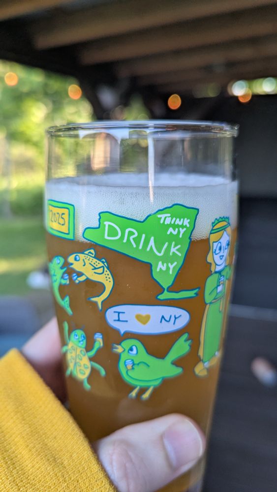 A glass of beer that says Think NY Drink NY