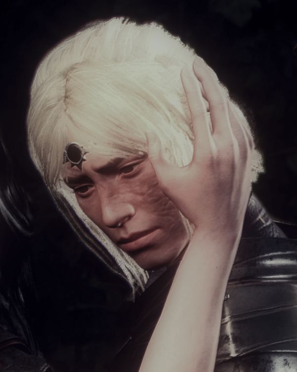 Cropped image of Lea (he/she), looking downward with a saddened gaze.