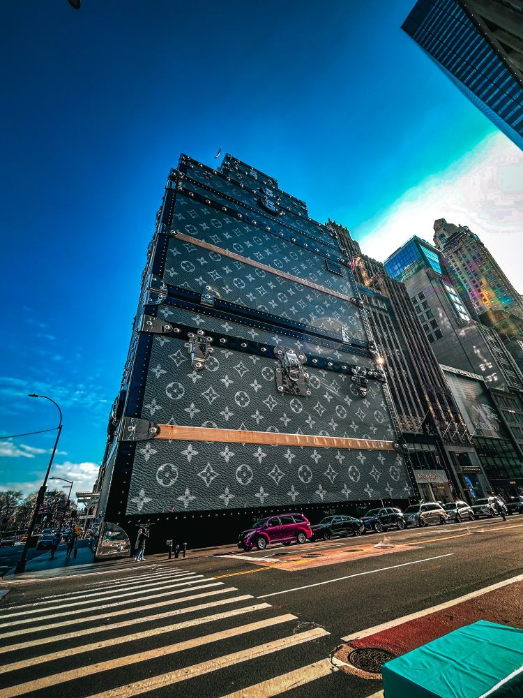 The outside of the Louis Vuitton store in NYC. It is wrapped to look like luggage