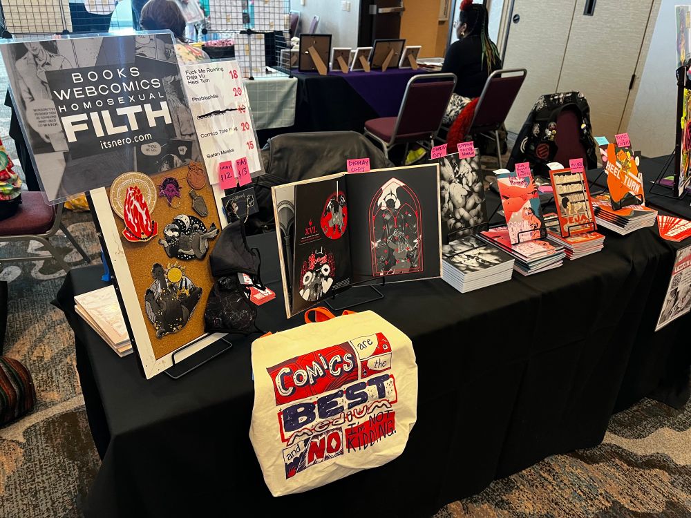 A photo of a dealer table with comics on it.