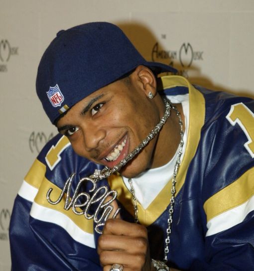 Nelly in the 90s, with a St. Louis Rams jersey and some bling