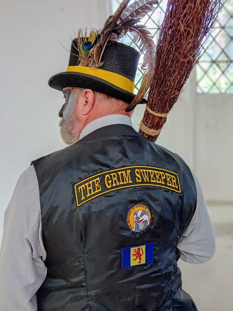 One of Misfit Molly with top hat, broom over shoulder and patches on his waistcoat... 'the Grim sweeper' across his shoulders, beneath that 'badger of honour' and below that the wonderful Fenland Flag