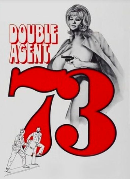 Poster for Double Agent 73. A hand drawing of Chesty Morgan appears behind the title. She's holding a small revolver and naked except a trench coat drapped on her shoulders. The number 73 in the title partially covers her body. In the bottom left corner is a small hand drawing of two men, one handing another a suitcase. Both men look like they are in a hurry and looking around to make sure no one is looking. 