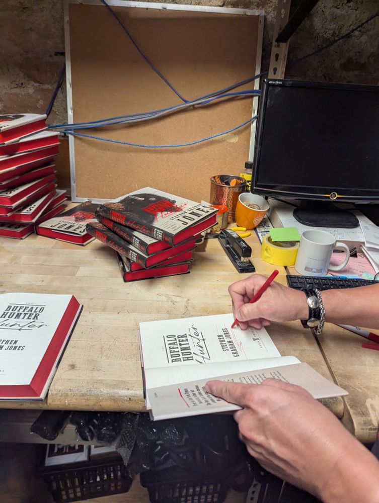 Dude signing up some books