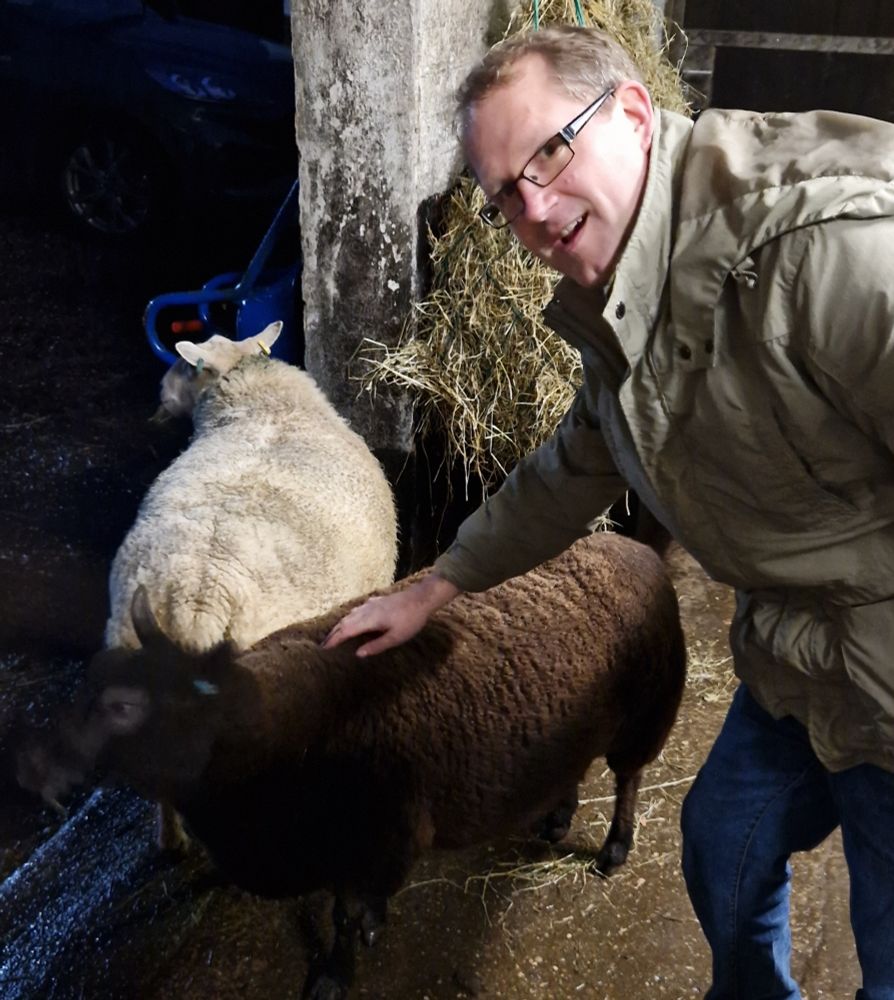 Garry with a black and white sheep