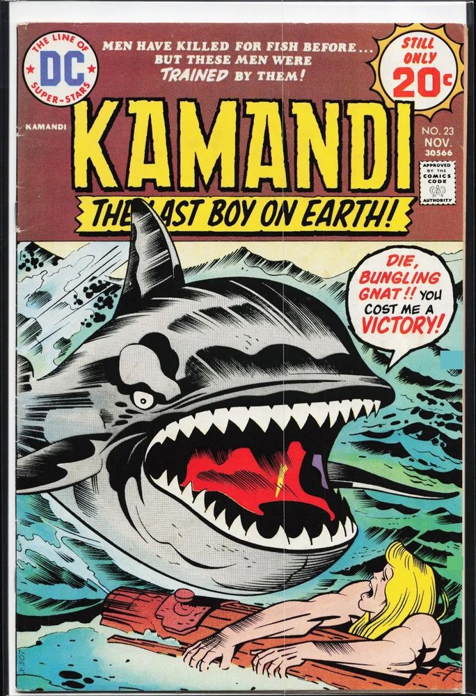 Cover of kamandi 23 showing kamandi clinging to a log in the ocean while a shark screams at him 