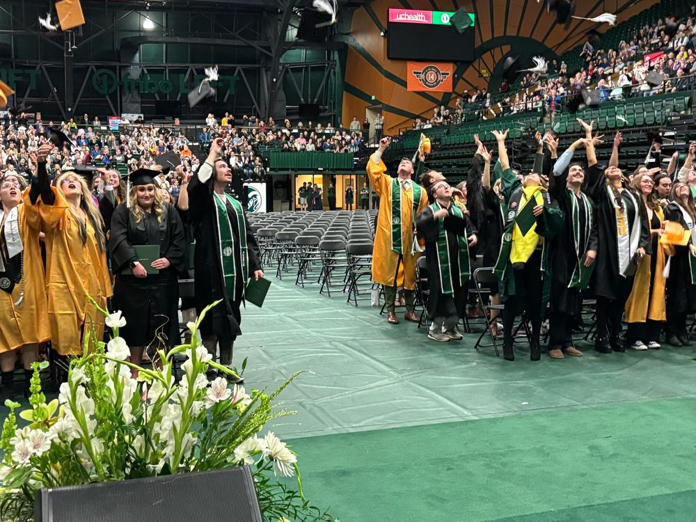 College graduates toss their mortarboards 
