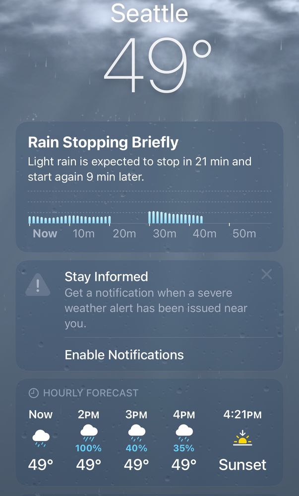A screenshot of the weather app showing a rainy Seattle day 