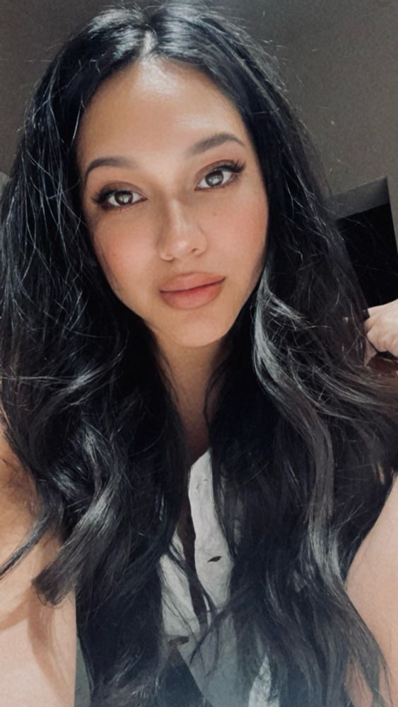 selfie of a woman with long, black hair
