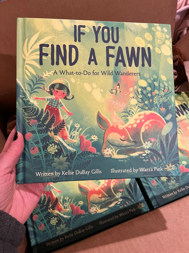 Hand holding a copy of IF YOU FIND A FAWN by Kellie DuBay Gillis and Wazza Pink from Disney Planet Possible Books. 