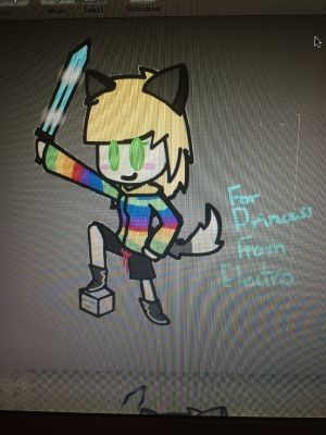 Blonde girl in a rainbow hoodie, she is stepping on a minecraft skull and raising a sword confidently. The quality is pretty bad, and it's a picture of a screen instead of properly exported as an image itself.