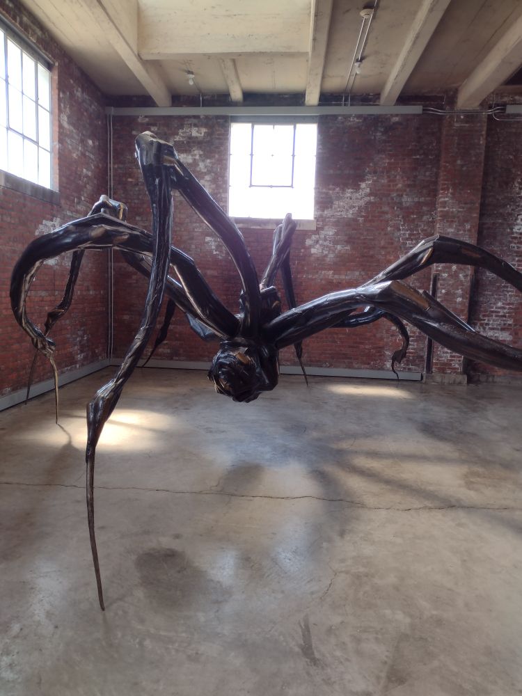 A sculpture of some kind of giant monster/spider thing with razor sharp legs. 