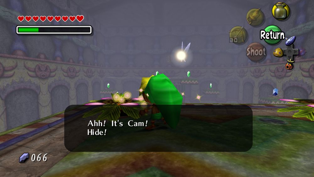 A screenshot of The Legend of Zelda: Majora's Mask, played via PC port 2Ship2Harkinian.
Deku Link approaches the hosts of the Deku Playground minigame, but they both hide, crying out "Ahh! It's Cam! Hide!"