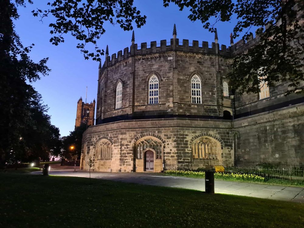 Image shows part of Lancaster Castle and the Priory. 