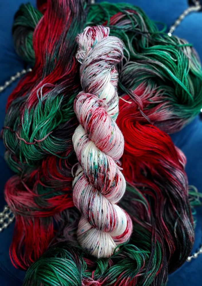 A speckled red, green, and black skein. 