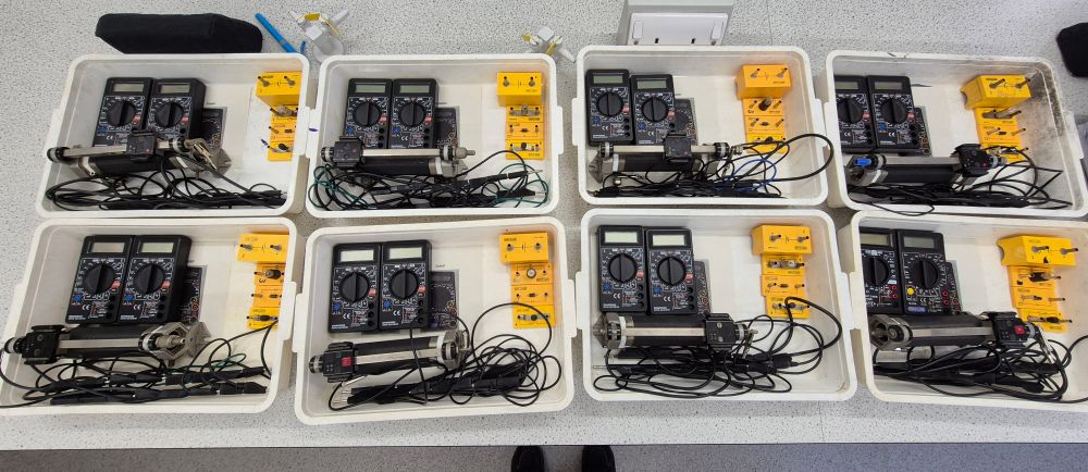 Eight trays of equipment for an electric circuits practical. 