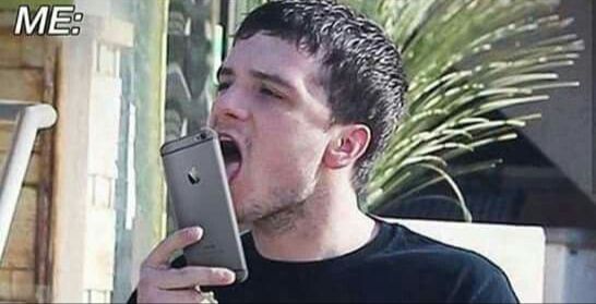 Josh Hutcherson licking a phone