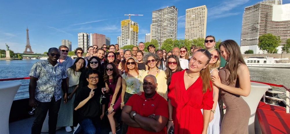 Group of people smiling at the camera on a boat