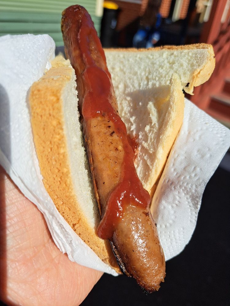 Sausage with sauce in white bread. Known as a democracy sausage.