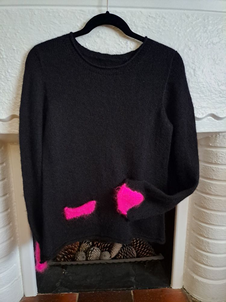 Black jumper with hot pink pocket and sleeve inserts 