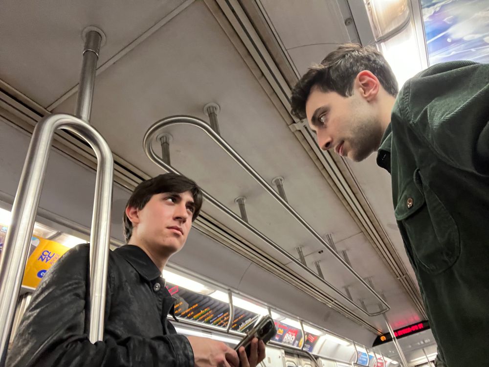 Michael and I facing each other in a New York City subway car