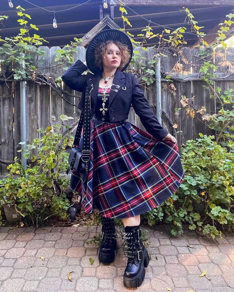 black and red tartan dress with cropped blazer and spiky boots