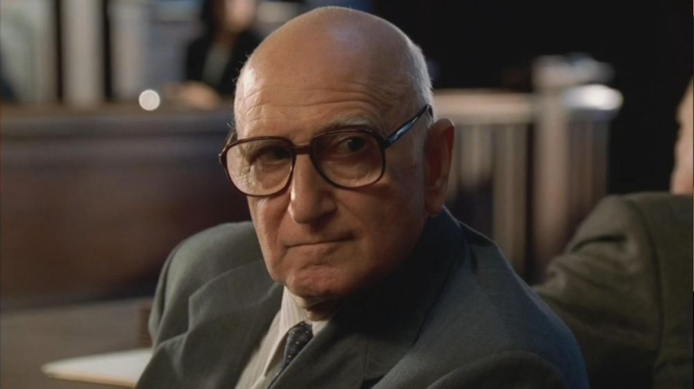 Junior Soprano in court, looking fiercely at the sketch artist behind him.