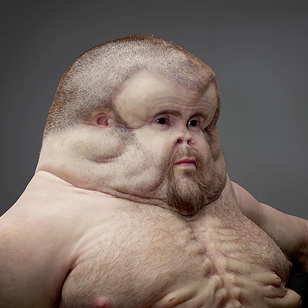 A proposed model of a human being evolved to survive car crashes, a shirtless figure with facial hair and a large padded head.