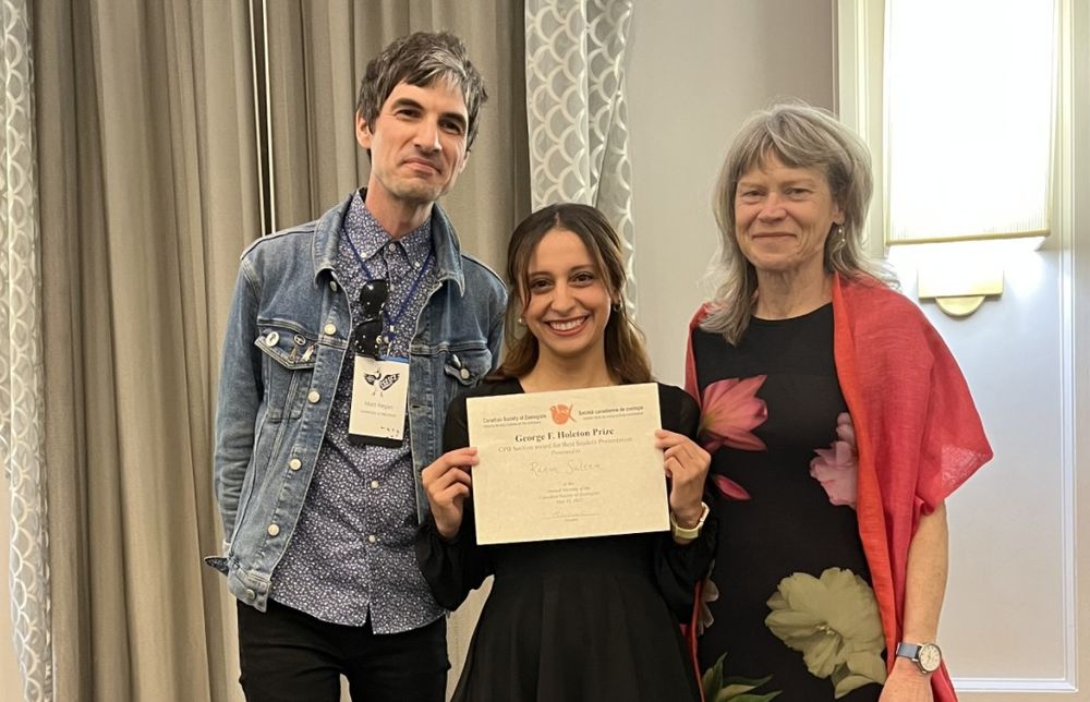 Photo of Ranim Saleem (centre) holding her JEB sponsored Holeton Award certificate at the CSZ annual meeting in Waterloo, Canada. Matt Regan, CPB Section Chair, is on the left and JEB Deputy Editor-in-Chief Pat Wright is on the right.
