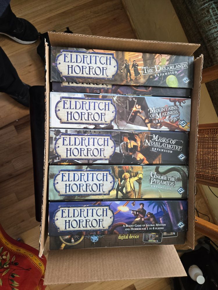 Base game and 4 large expansions for Eldritch Horror fit snugly in a box
