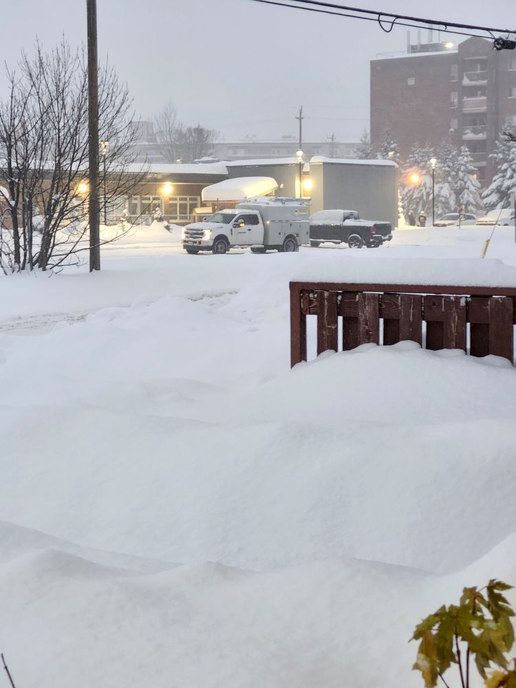 Enbridge truck sitting and watching down the street's work.