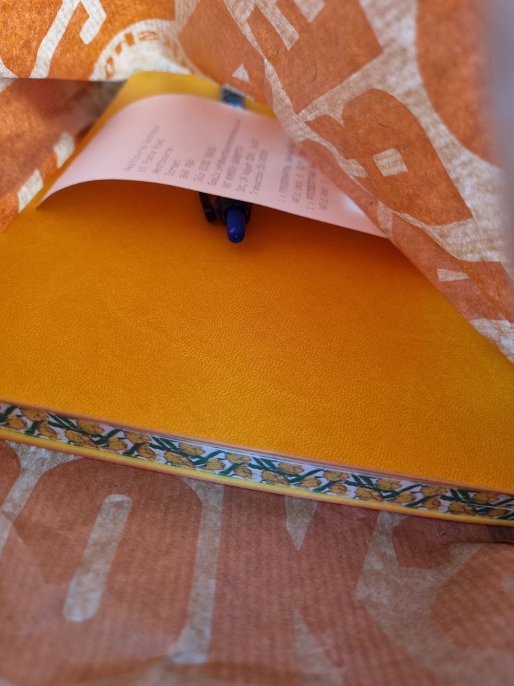 Marigold coloured notebook with floral sprayed edges