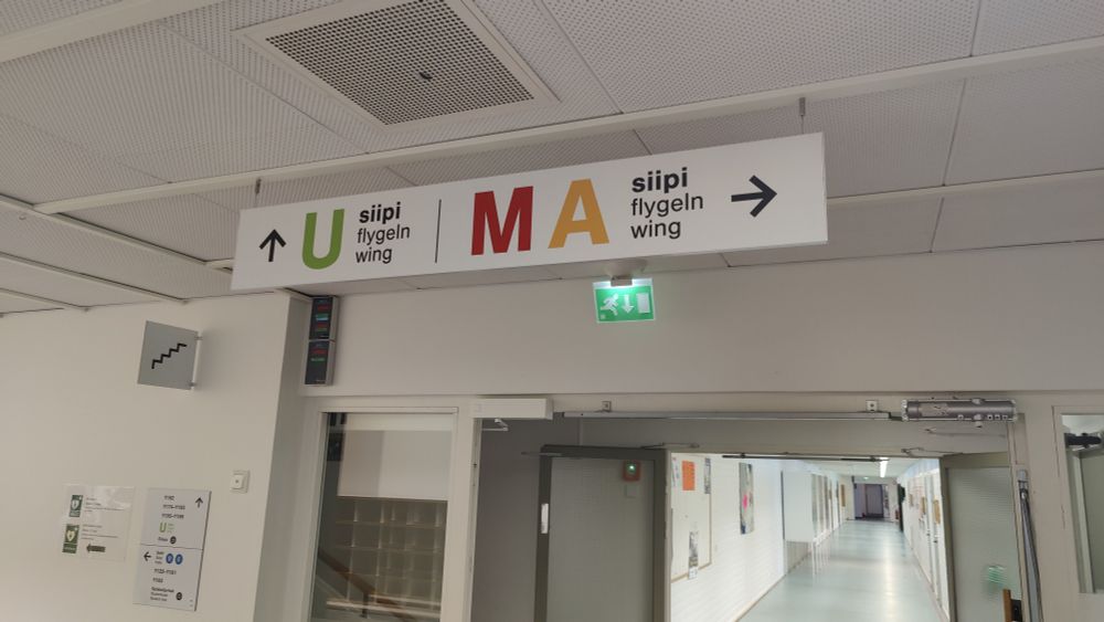 Sign pointing to wings U, M, and A