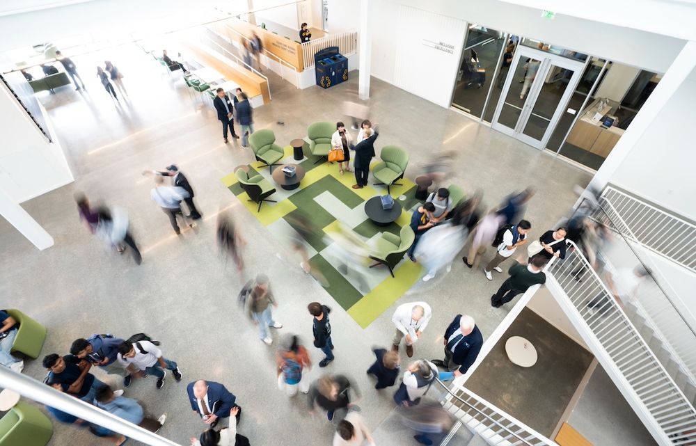 Overhead view of motion-blurred attendees at the Grimes Engineering Center’s opening celebration. (Photo by Adam Lau/Berkeley Engineering)