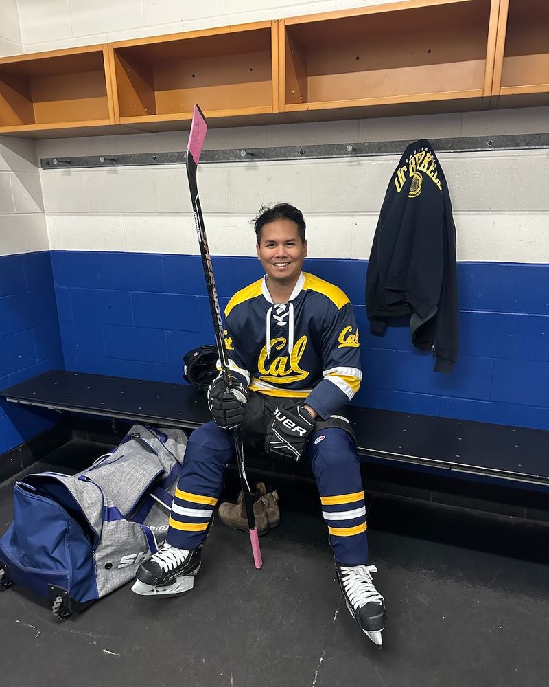 Seva seated in a hockey uniform. (Courtesy)